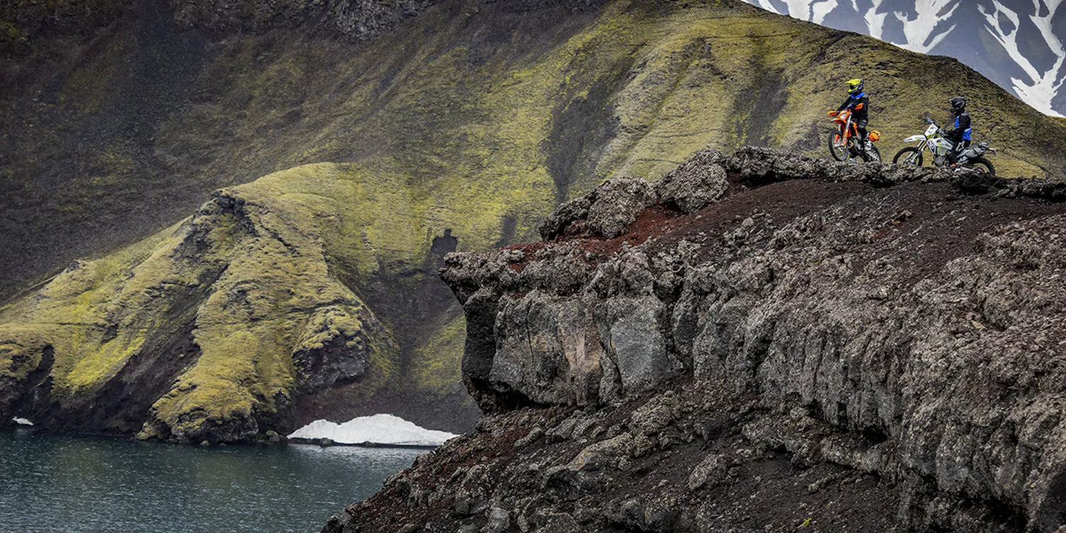 two enduro riders in mountains