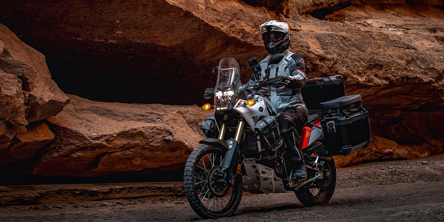adventure bike rider near caves