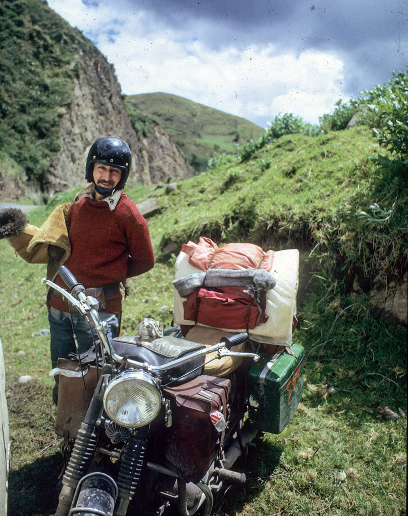 ted simon with motorcycle in mountains