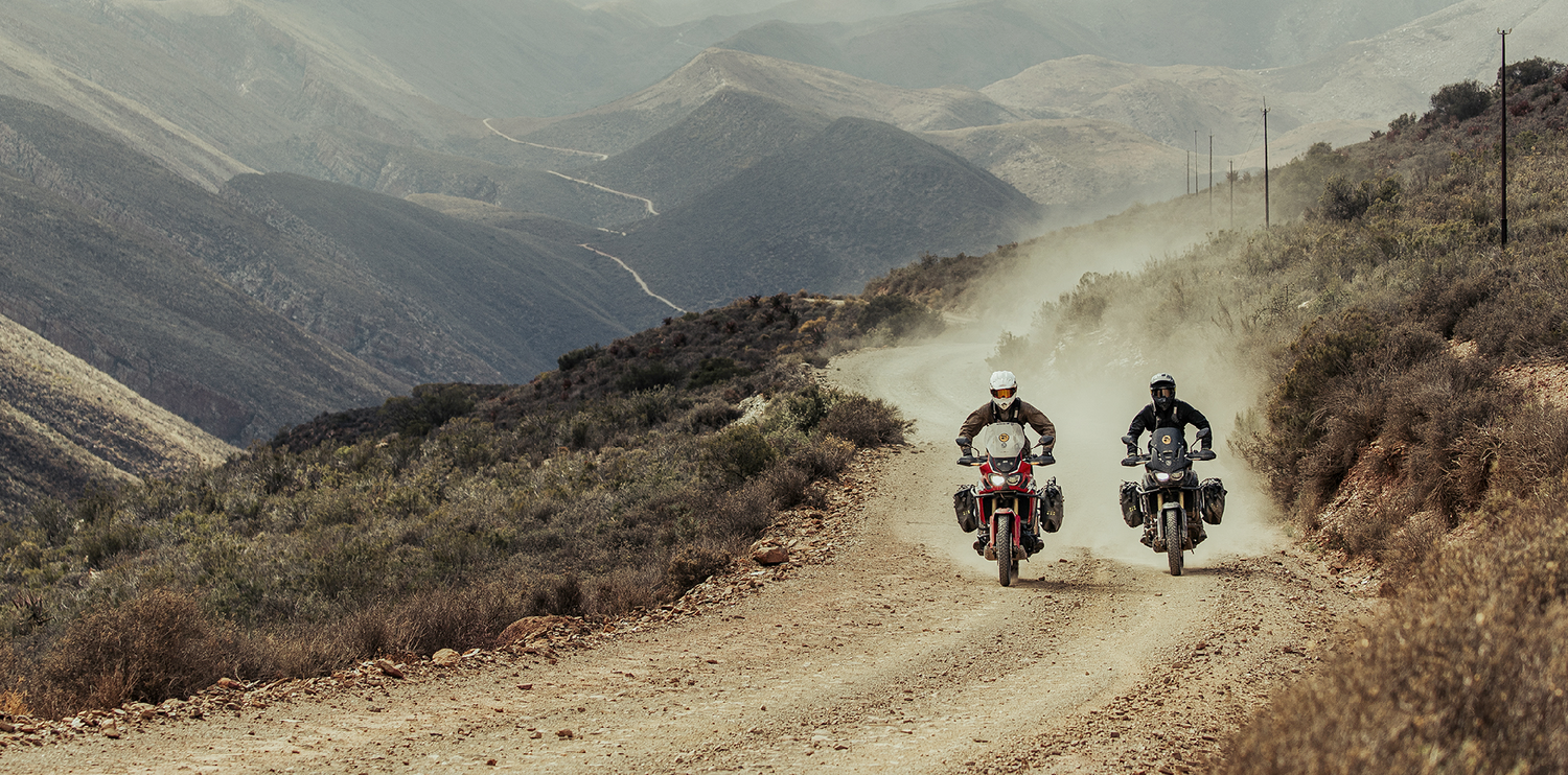 two adventure motorcycle riders with soft luggage systems