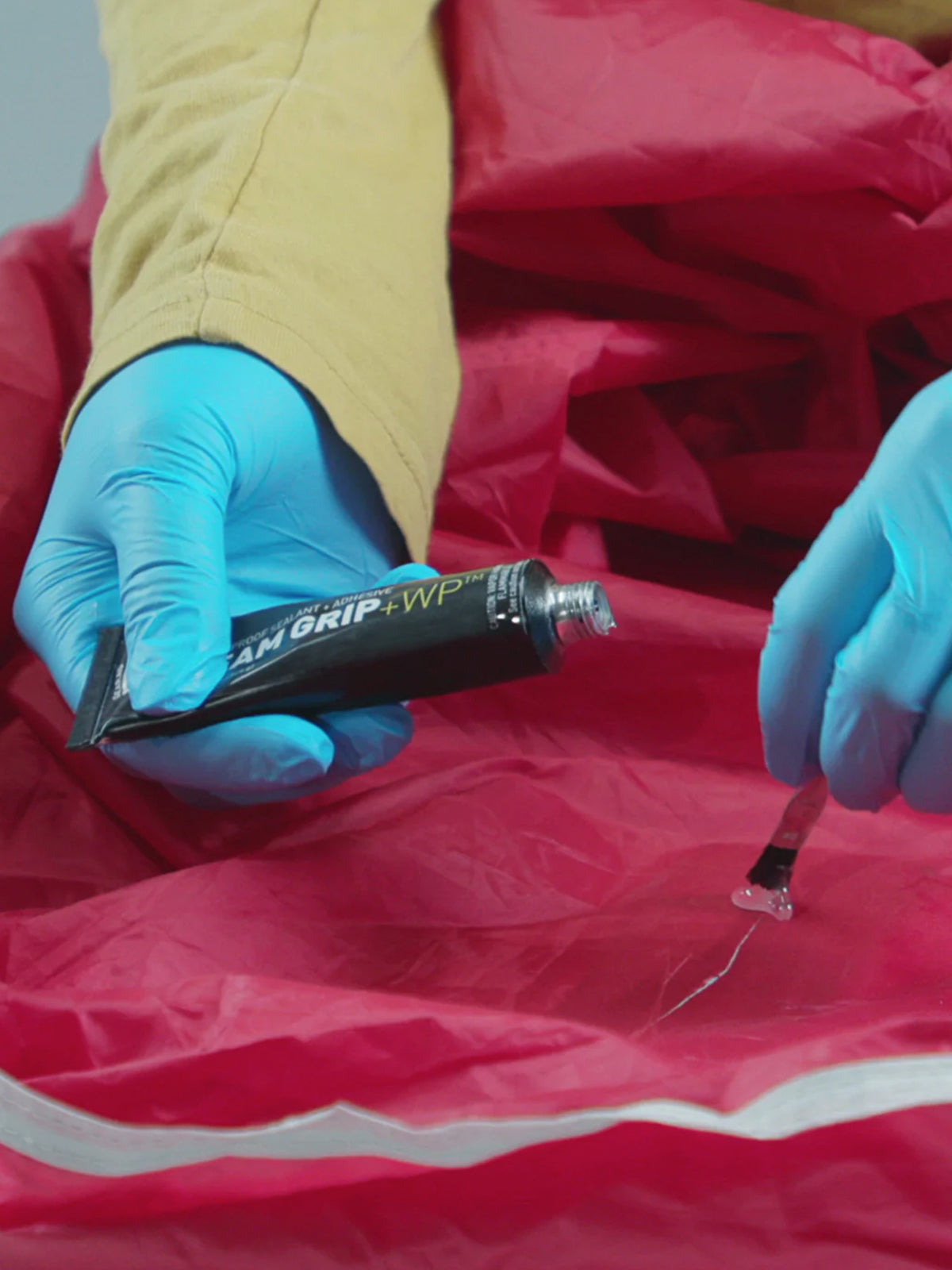 tube of Gear Aid Seam Grip + WP Waterproof Sealant being used