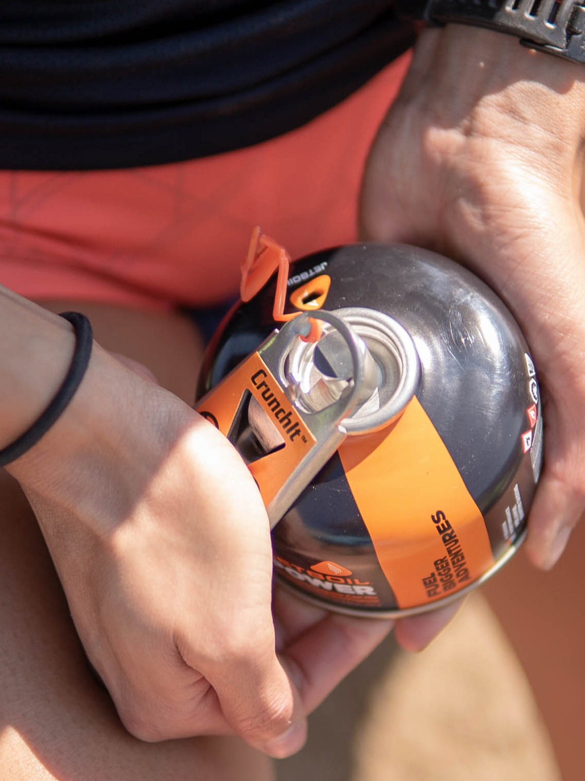 Jetboil CrunchIt Fuel Can Recycling Tool being used