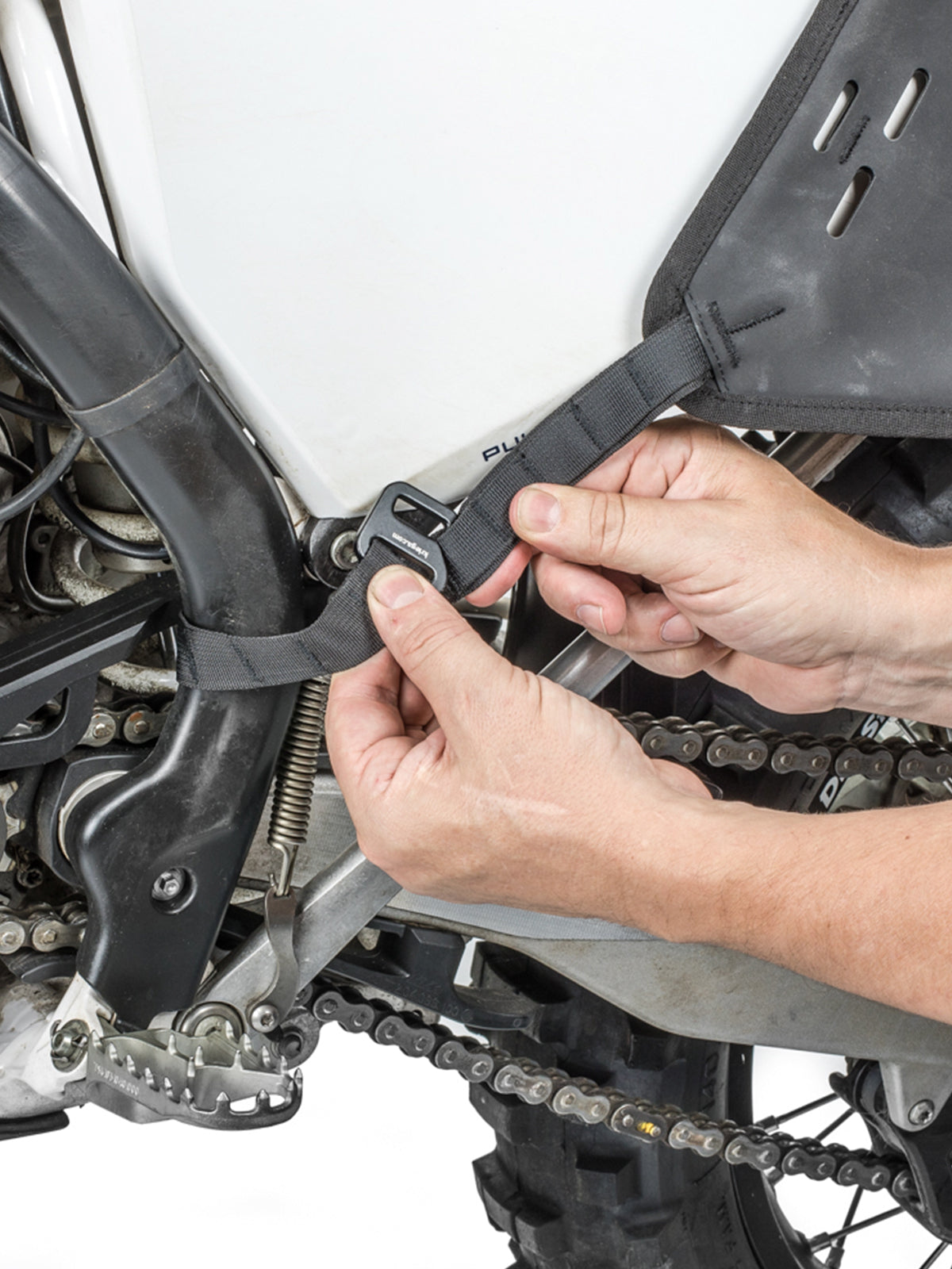 Kriega OS BASE being attached to bike