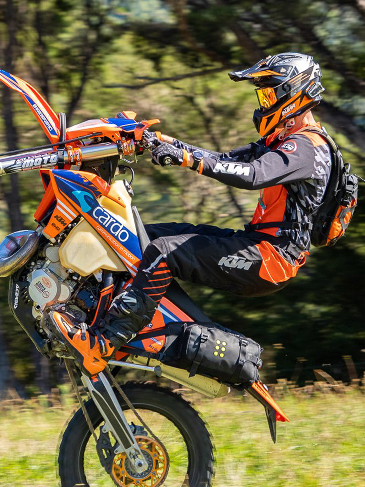 chris birch wheelie with Kriega OS BASE Dirtbike