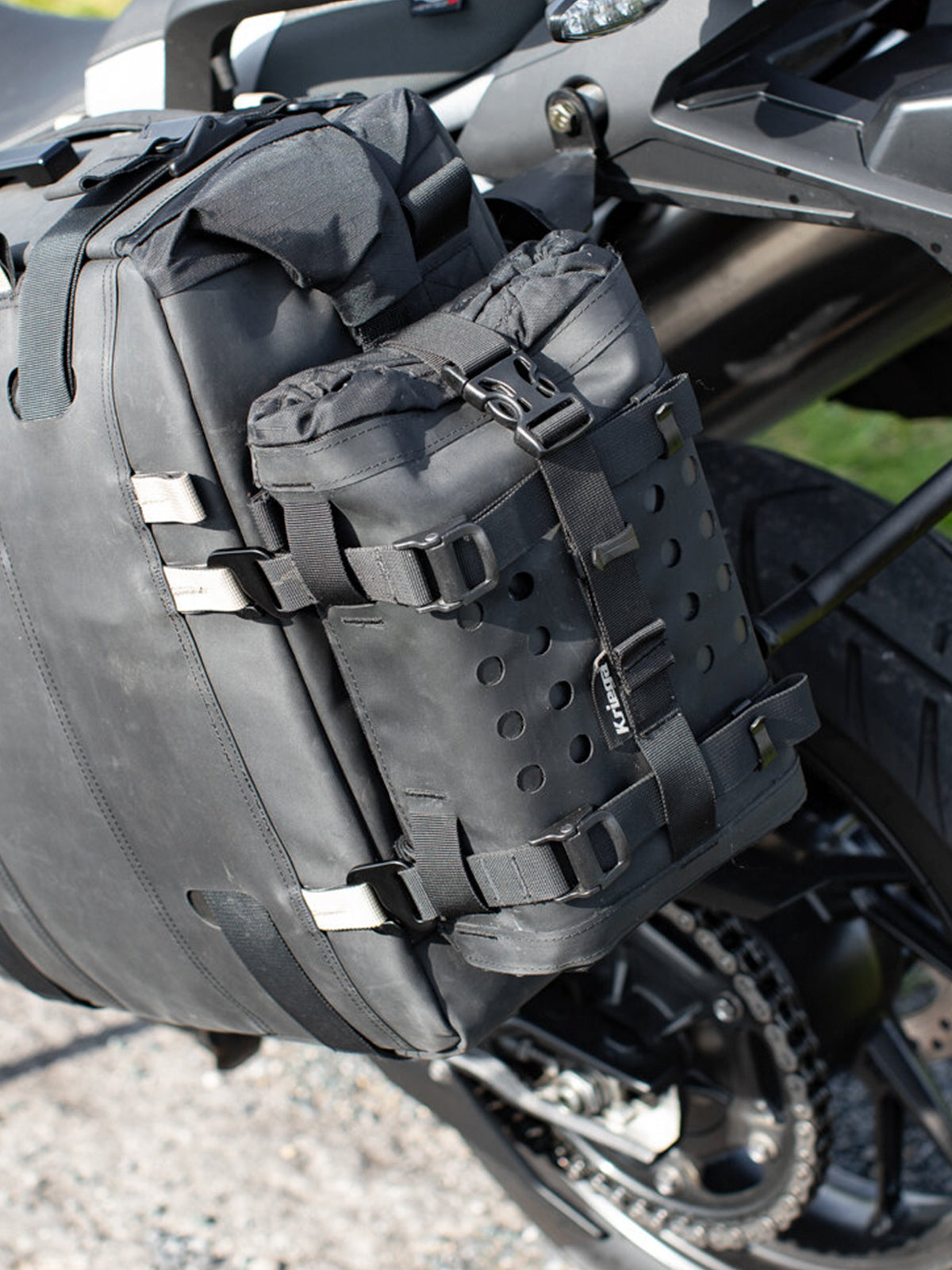 Kriega OS Bottle fitted to panniers on motorcycle