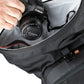 putting a dslr camera in roll top pocket of the Kriega R22 Backpack