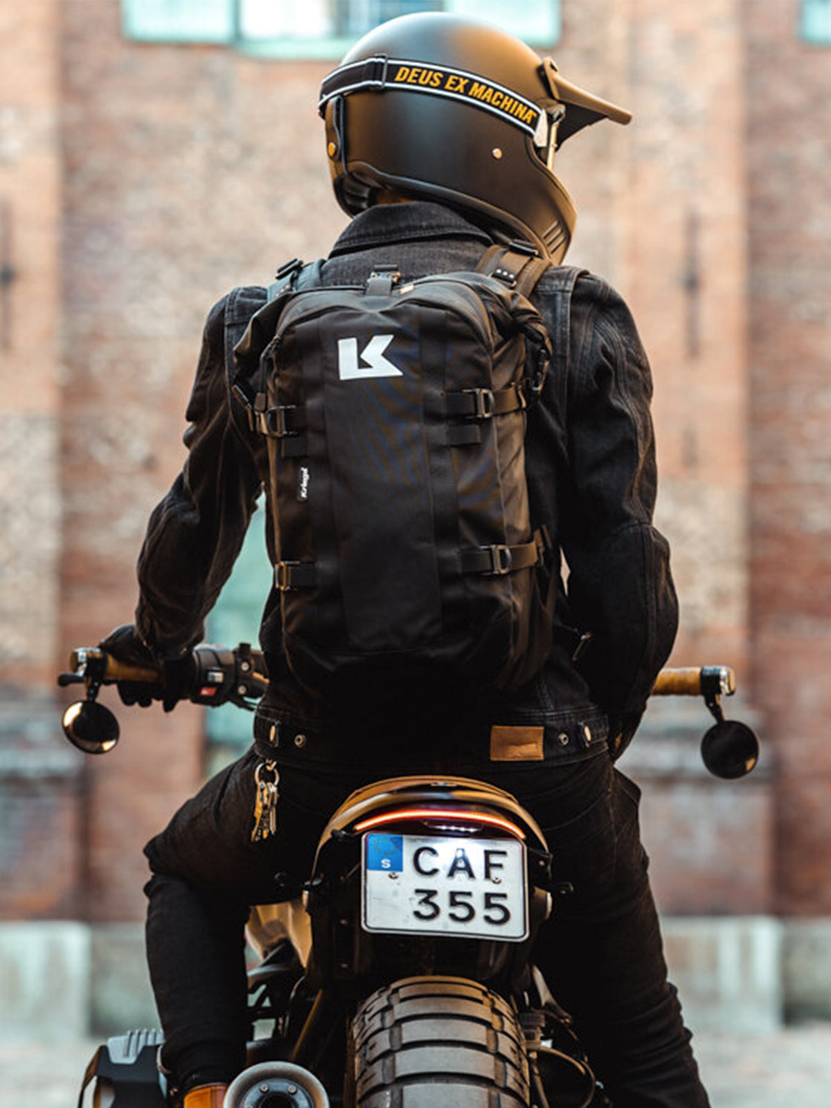 back view of motorbike rider wearing Kriega R22 Backpack
