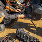 motorbike rider fixing his bike with the Kriega R8 Waist Pack on the ground