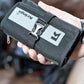 Kriega Stash Wallet in riders hand
