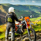motorbike rider wearing the Kriega Trail9 Adventure Backpack in the mountains