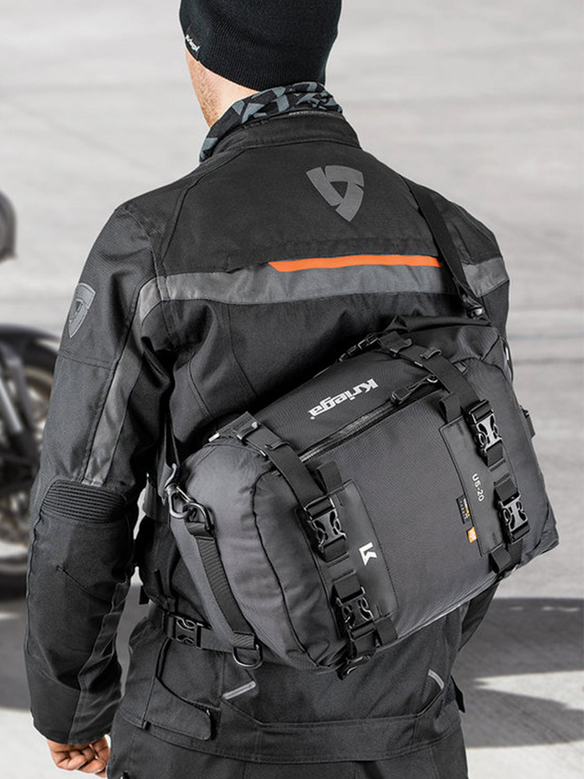 motorbike rider wearing Kriega US20 Drypack with shoulder strap